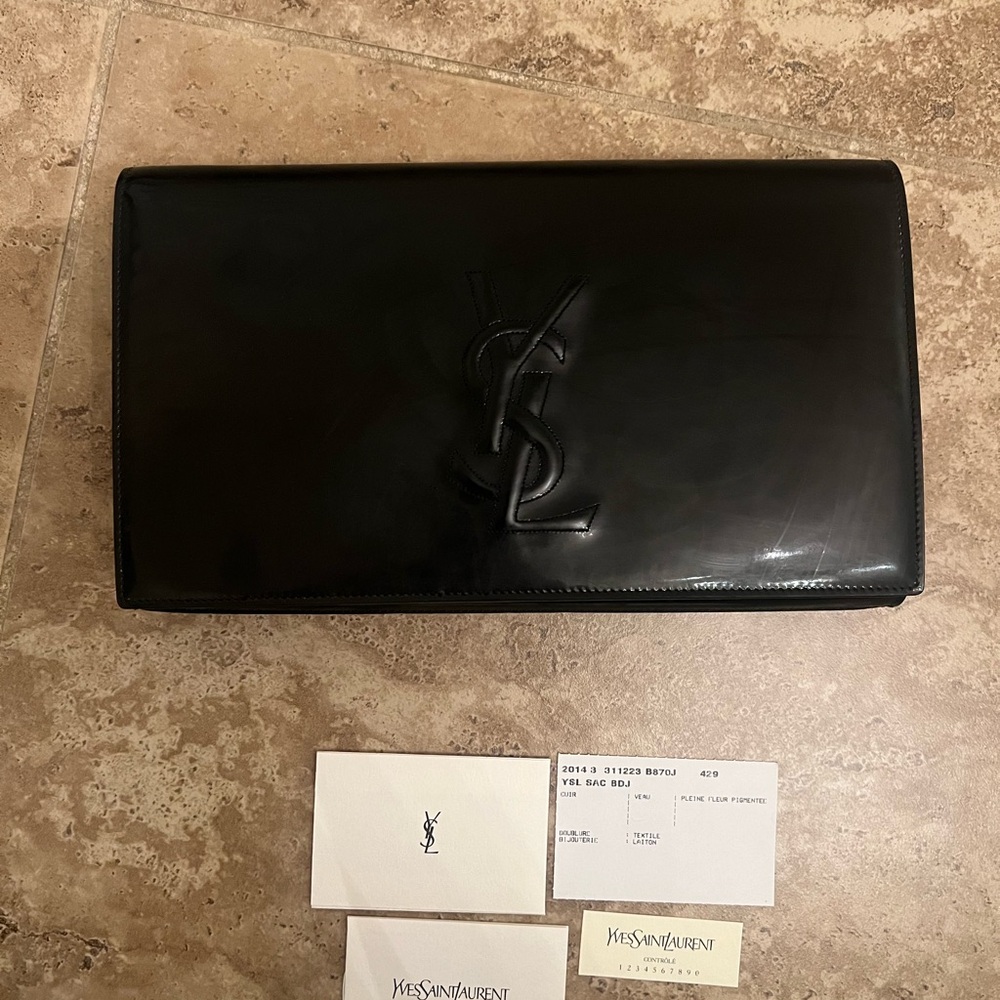 Yves Saint Laurent
Belle de Jour vinyl clutch bag

Black, Vinyl